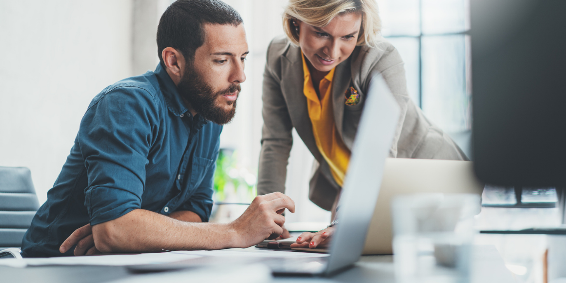 digital transformation in accounting man and woman look at laptop